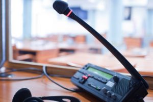 microphone and switchboard in an simultaneous interpreter booth